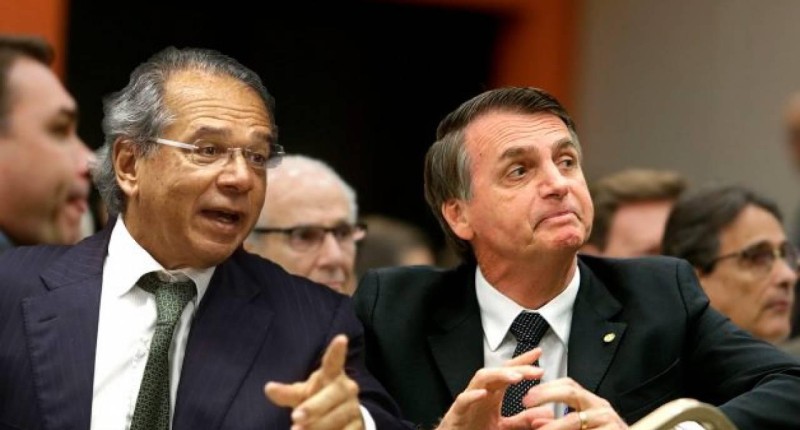 Nos EUA, ao lado de Bolsonaro, Guedes fala em fusão entre BB e Bank of America